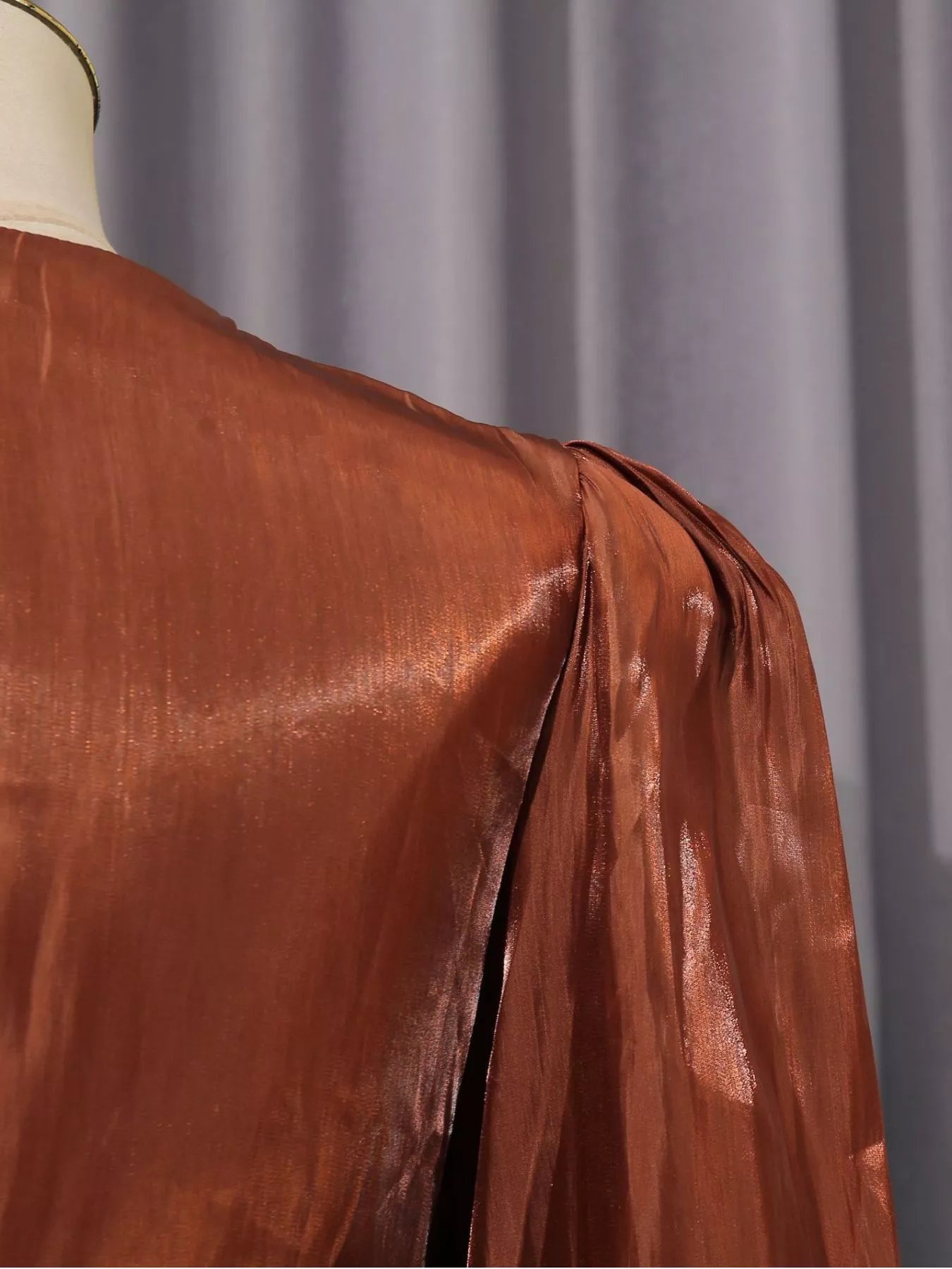 Cedar & Moore Front Twisted Draped Long Sleeve Maxi Dress in rust satin fabric.