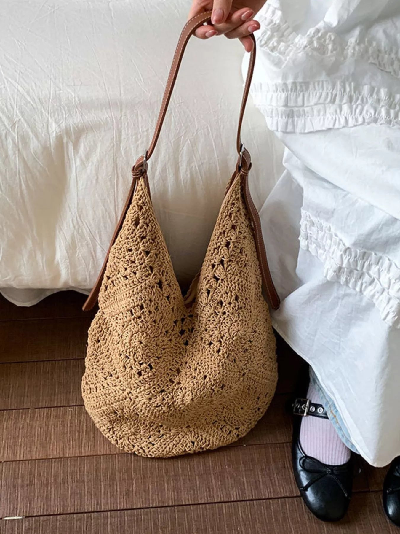 Camel crochet shoulder bag with brown leather straps and openwork knit texture