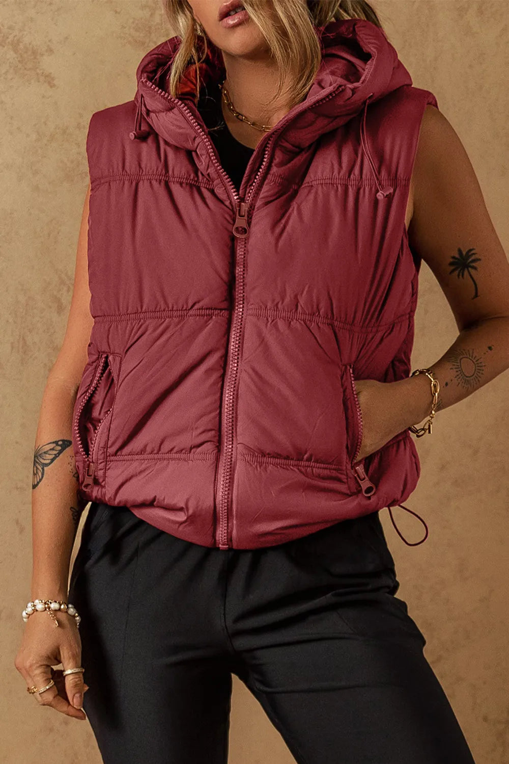 Burgundy hooded sleeveless puffer vest coat with front zipper and drawstring hem