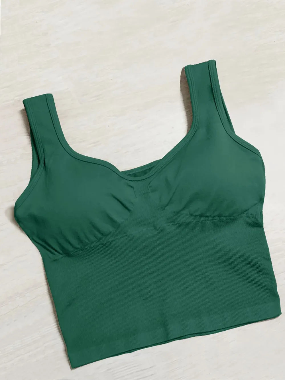 Green wide-strap active tank with scoop neck and ruched bust panel