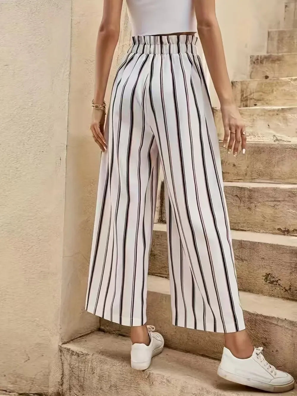 Striped wide-leg pants with elastic waistband and tie, vertical black-and-lavender stripes