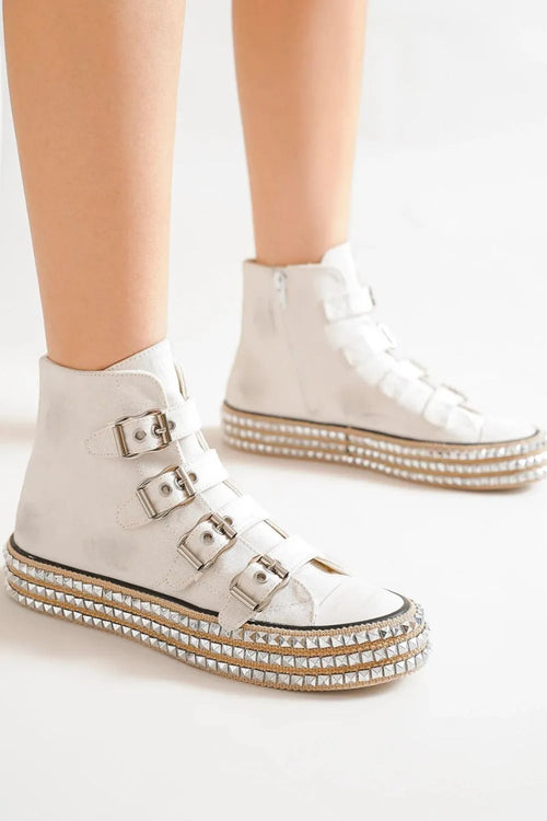 Light gray studded platform sneakers with multi buckle straps and textured tread