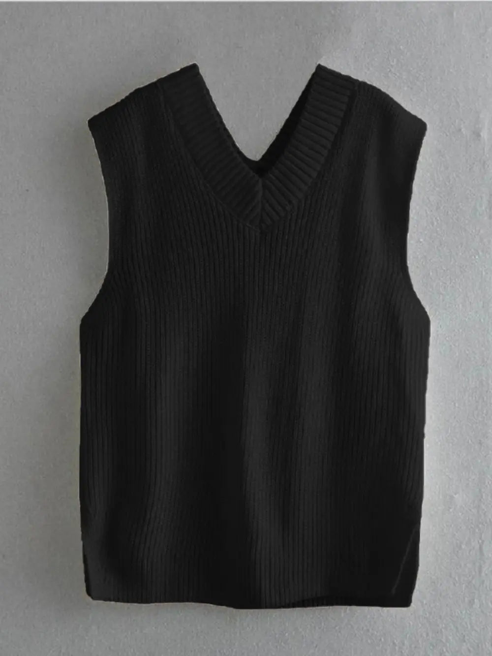 Black ribbed V-neck sleeveless sweater vest on hanger, straight hem.