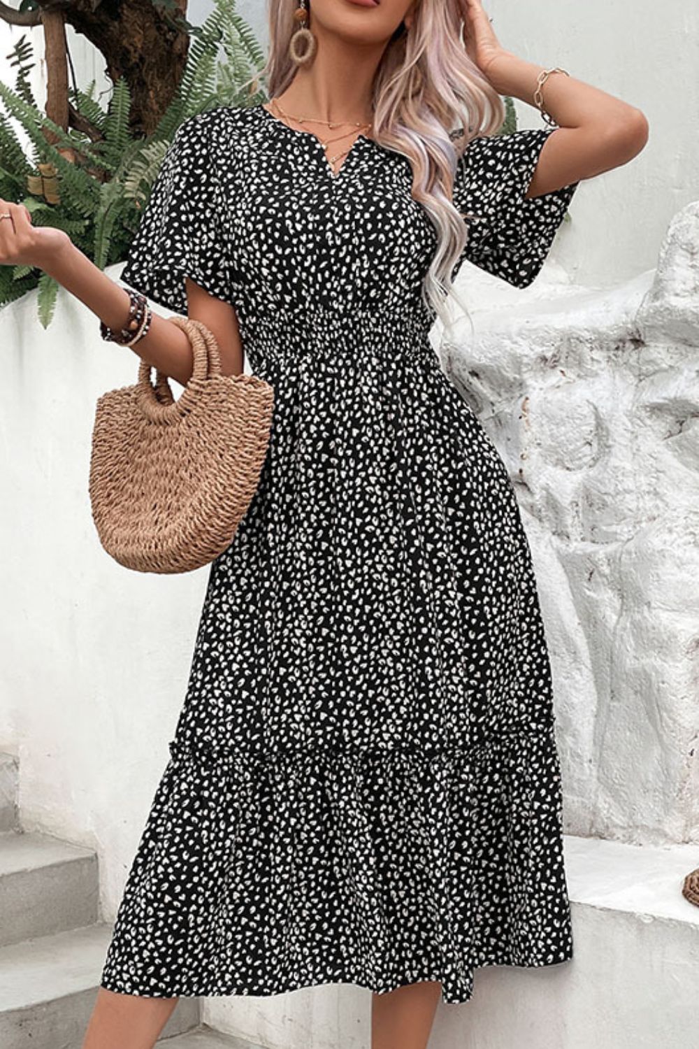 Black leopard print midi dress with short sleeves and V-neck, tiered pleated skirt