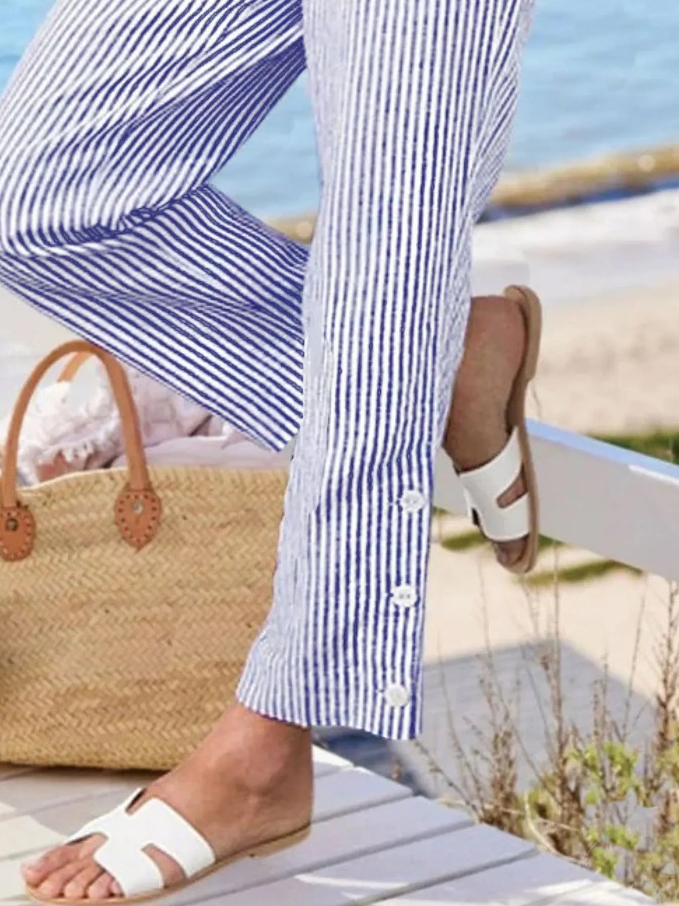 Striped ankle pants with side buttons and elastic waist, blue-and-white stripes