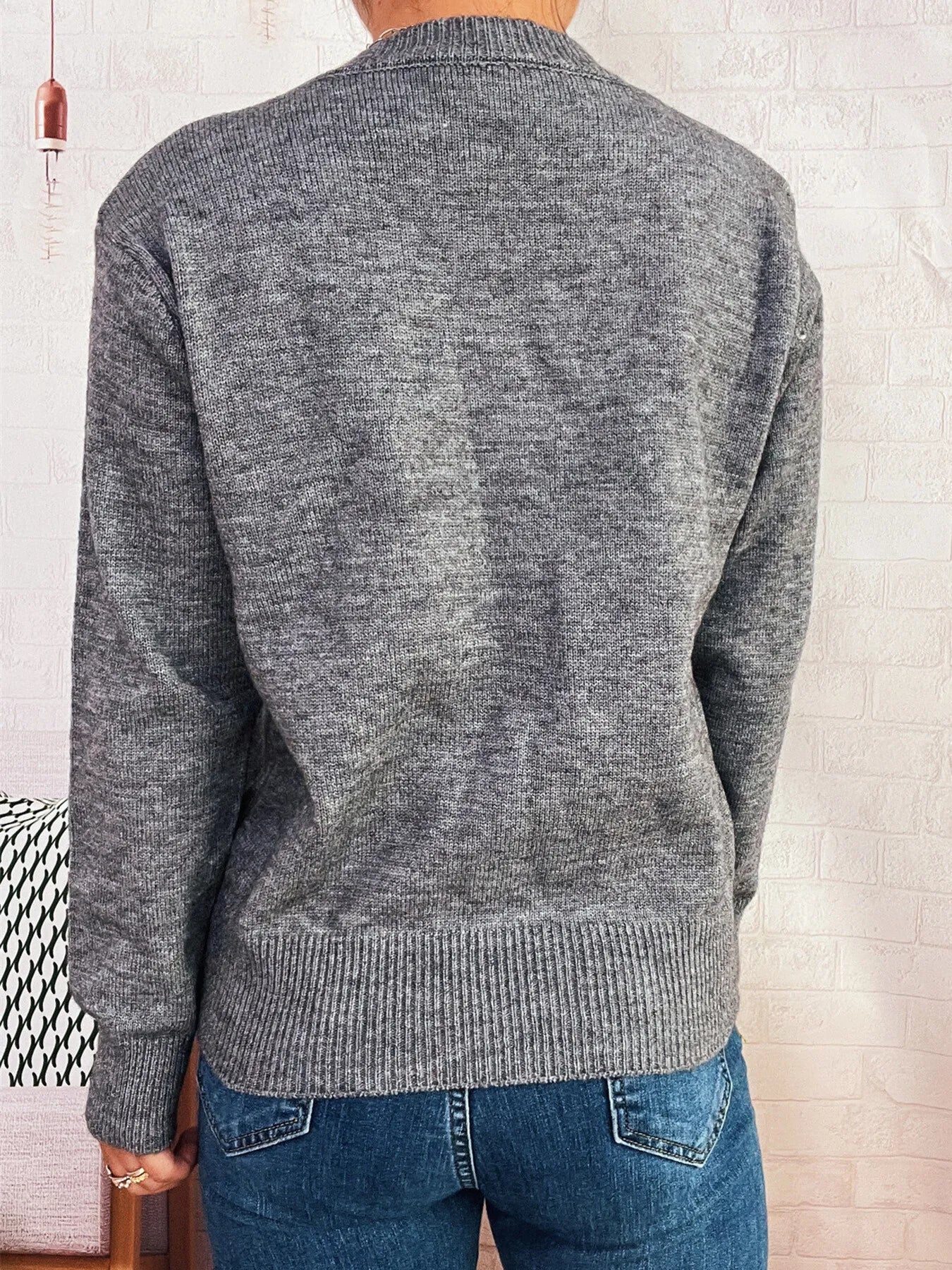 Gray knit cardigan with ribbed cuffs and hem