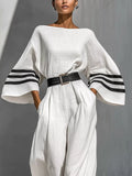 White wide-sleeve jumpsuit with striped cuffs and black waist belt