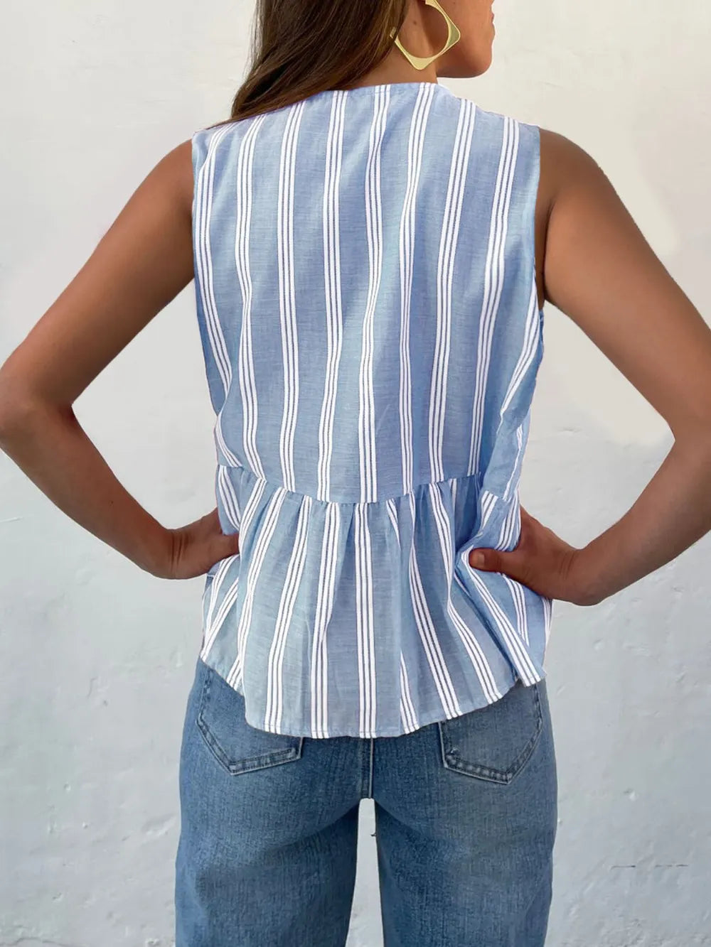 Light blue striped sleeveless tank top with gathered waist, back view