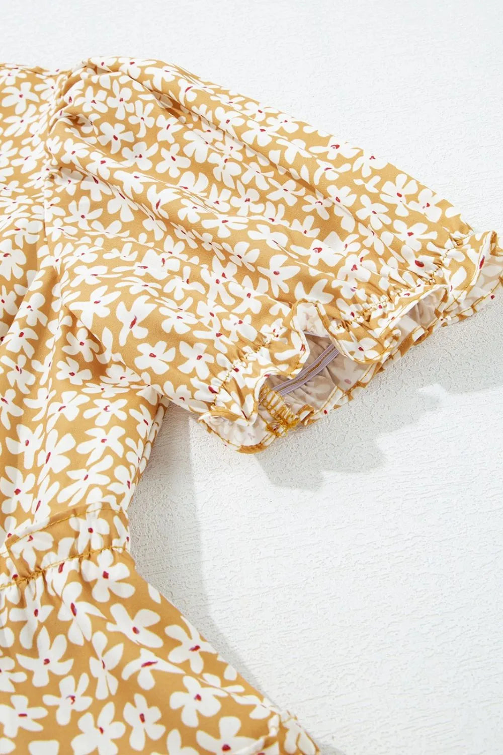 Floral mustard-yellow dress with white flower print and elastic-cuffed short sleeves
