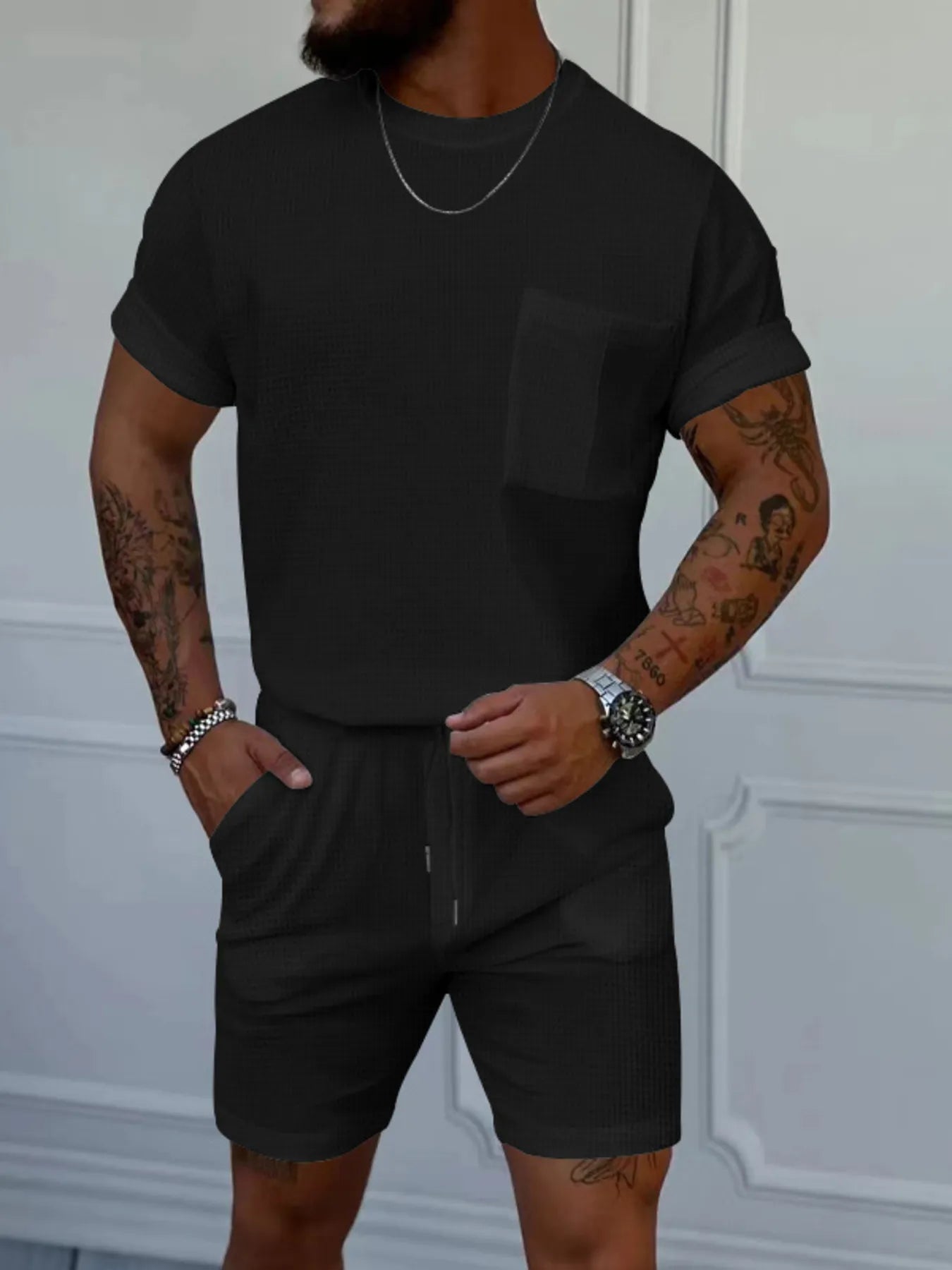 Men's black short-sleeve round-neck top and shorts set with chest pocket