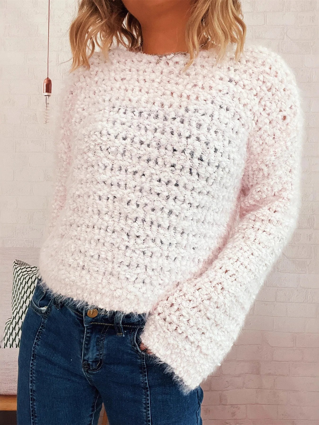 White crochet round-neck sweater with dropped shoulders and long sleeves, textured knit