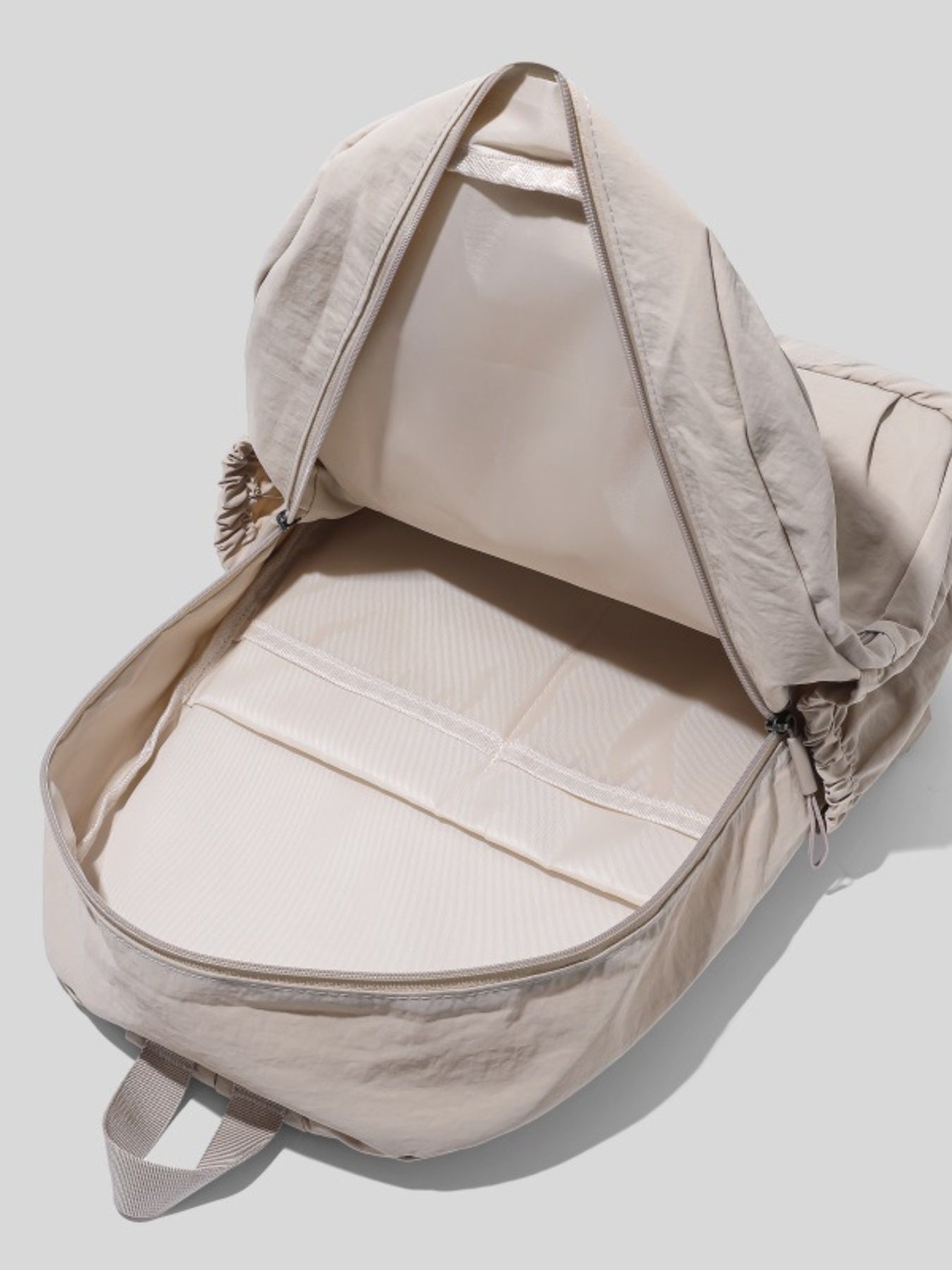 Cedar & Moore lightweight beige nylon backpack by Trendsi with large main compartment