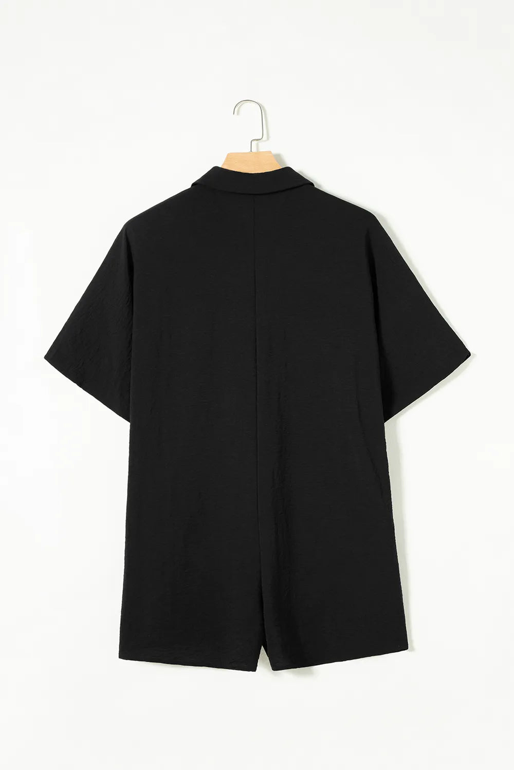 Black collared romper on hanger, back view with short sleeves