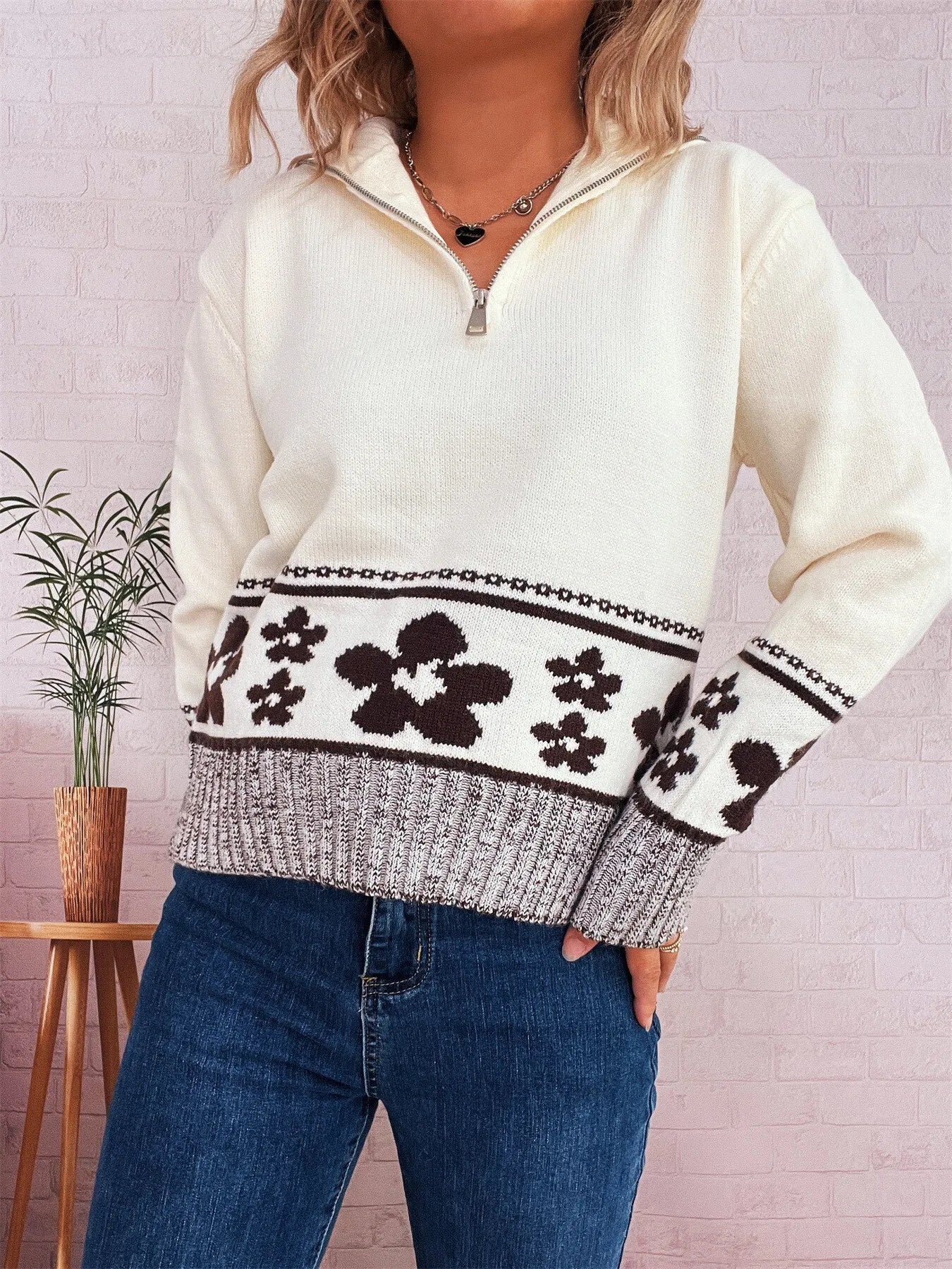 White zip-collar long-sleeve sweater with floral knit band and striped cuffs
