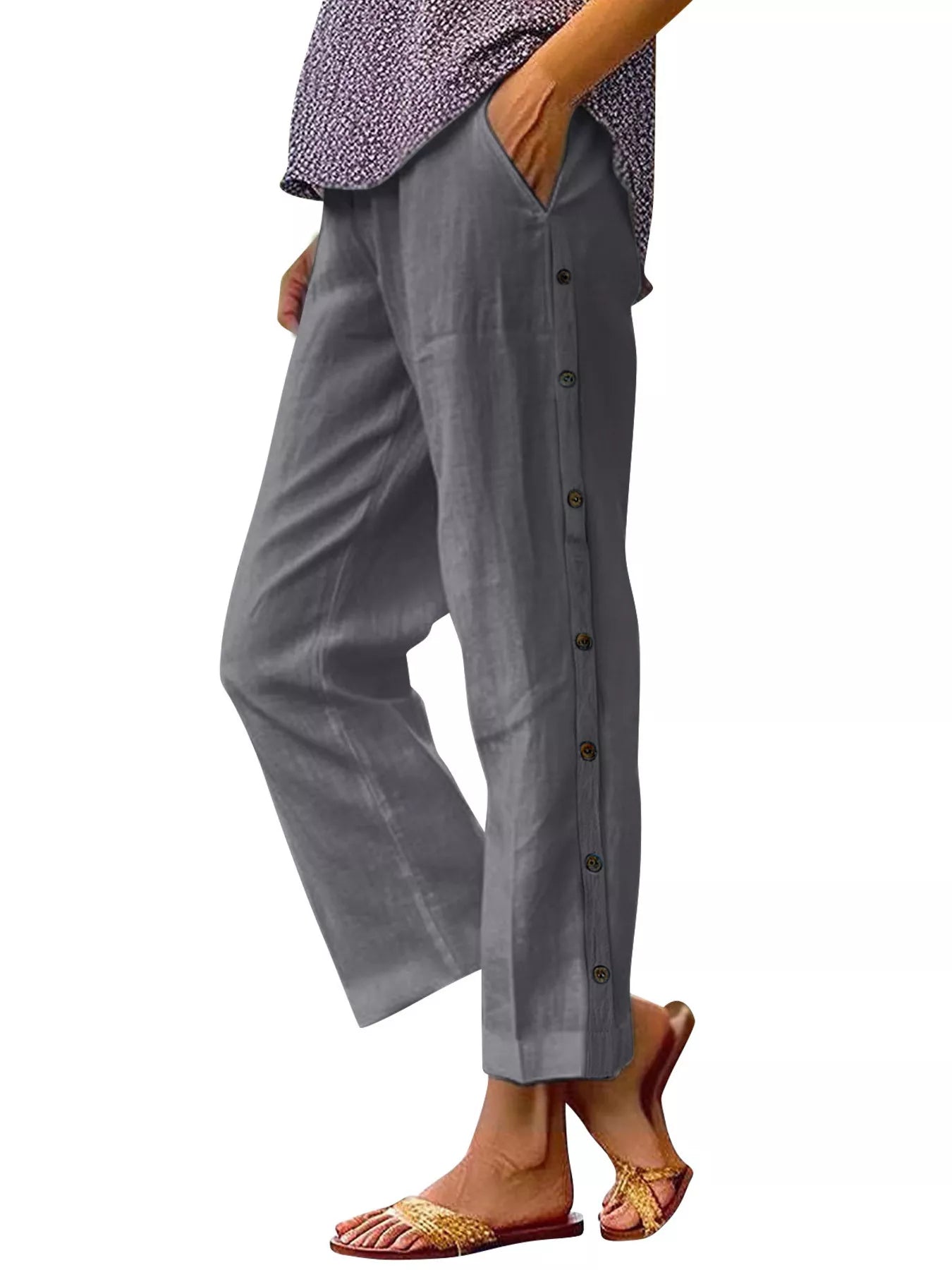 Dark gray polyester pants with side buttons and side pockets, relaxed fit