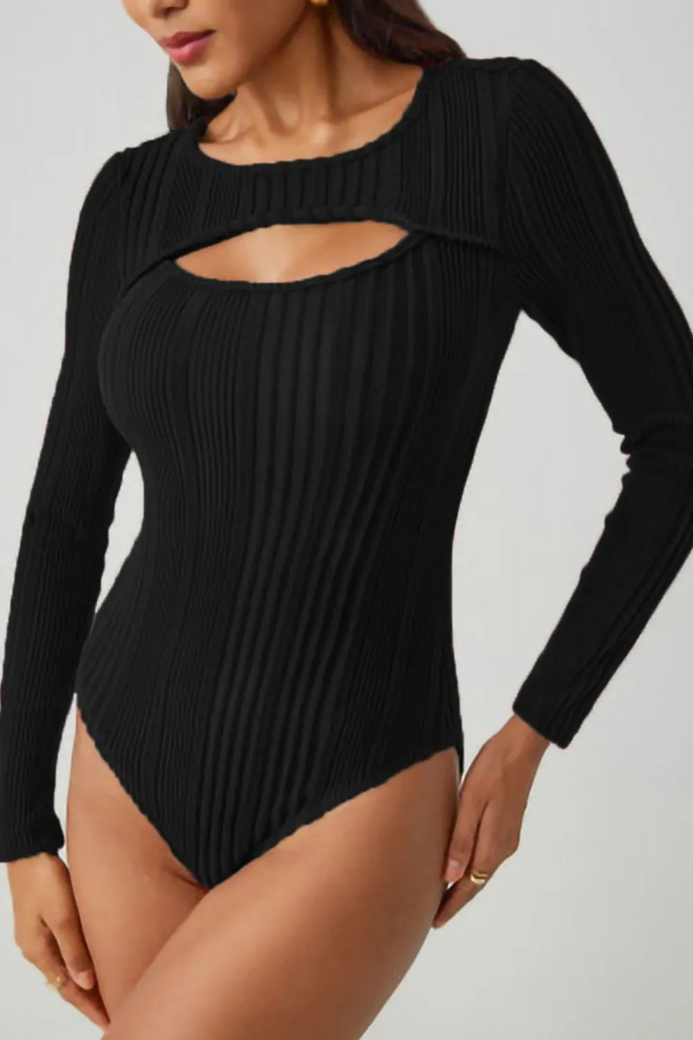 Black ribbed bodysuit with long sleeves, round neck cutout and thong-style bottom