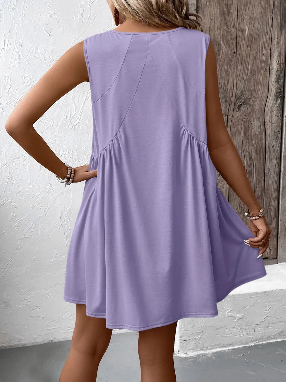 Ivy Lane Ruched V-Neck Sleeveless Mini Dress in lilac, back view with gathered waist.