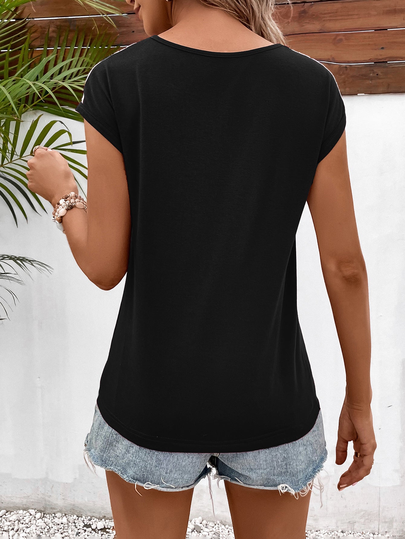 Cedar & Moore Ivy Lane Spliced Lace V-Neck Twisted Hem Tee in black, back view