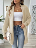 Beige oversized knit cardigan with open front, long sleeves, textured knit, hip length