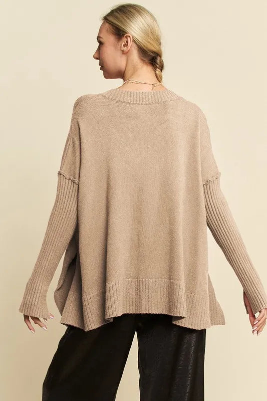 Tan ribbed V-neck sweater with relaxed back and ribbed cuffs