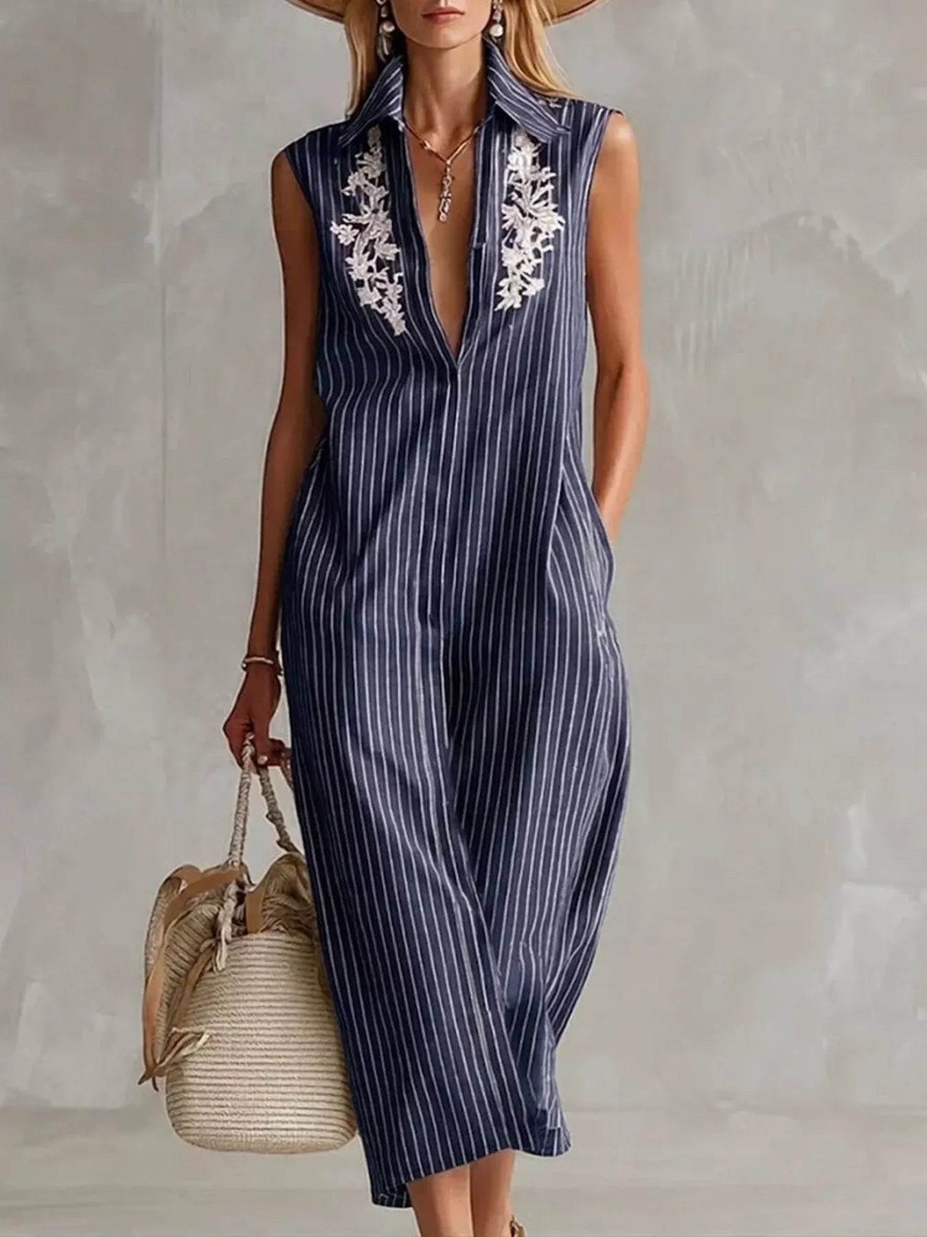 Navy blue striped sleeveless shirt dress with collared V neckline and white lace trim