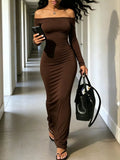Brown off-shoulder bodycon maxi dress with long sleeves, fitted silhouette.