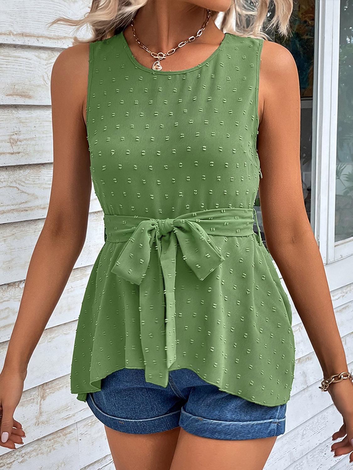 Mid green swiss dot sleeveless tie-waist peplum tank top with bow at waist