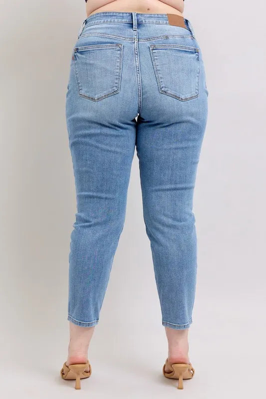 Plus size mid-rise slim jeans, light blue vintage wash, back view with two pockets