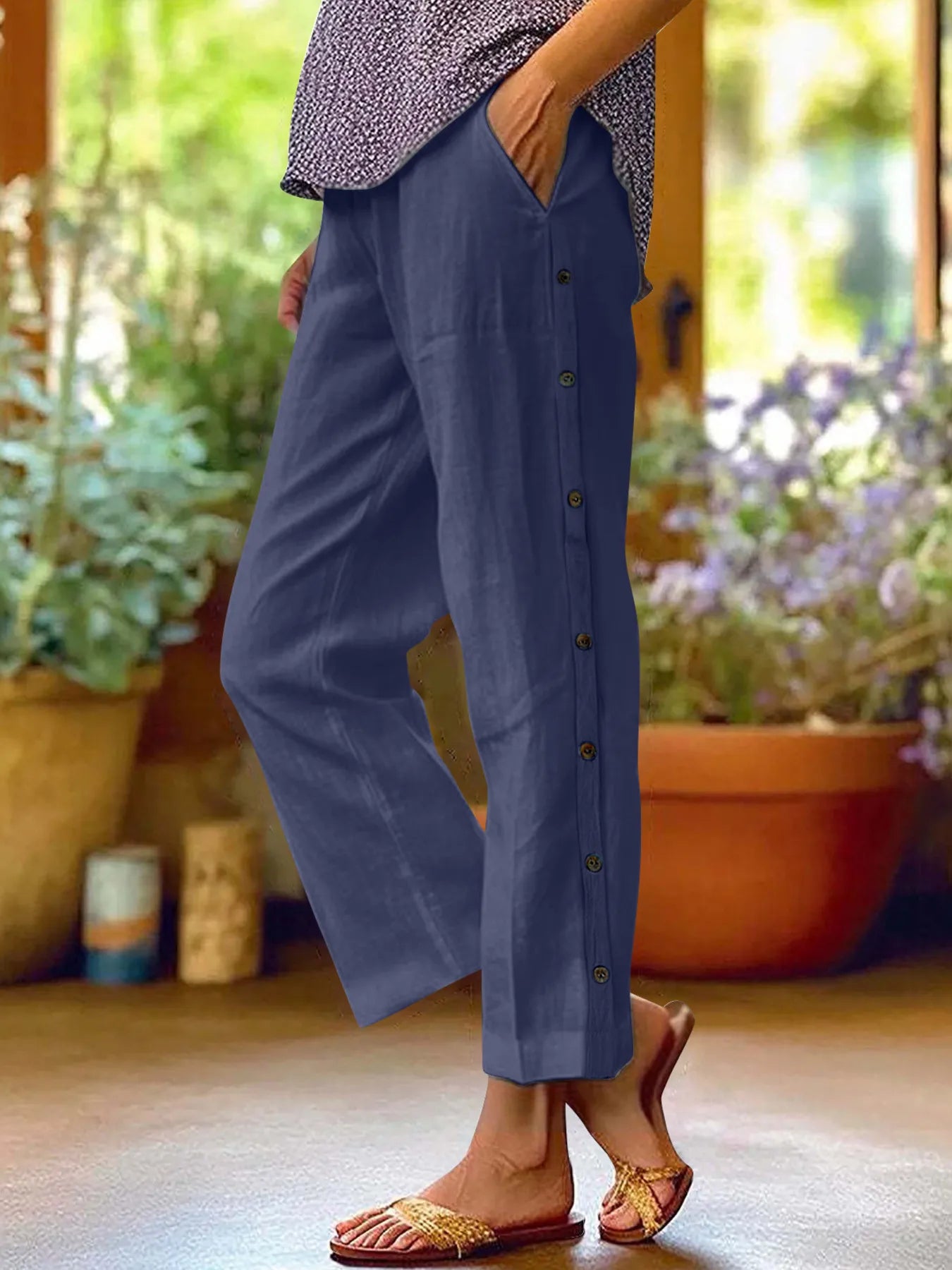 Navy blue wide-leg pants with side button detail and elastic waist