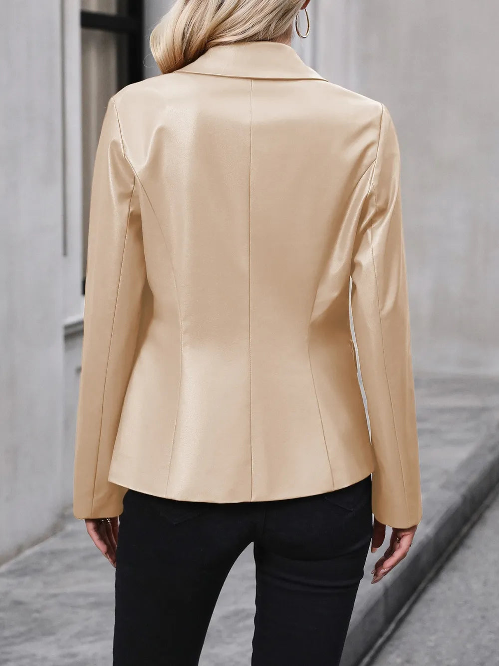 Women’s cream blazer back view with long sleeves and tailored center seam