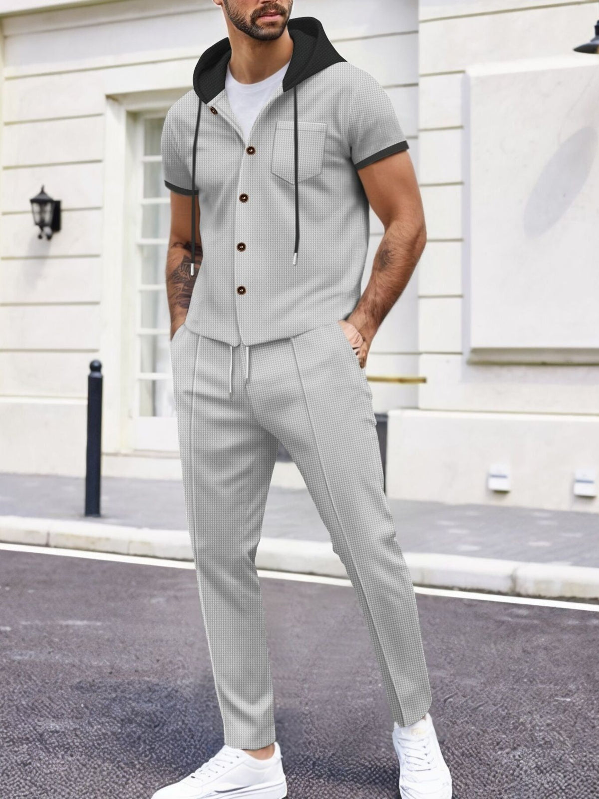 Light grey short-sleeve hooded top and matching jogger pants set, chest pocket, drawstring hood
