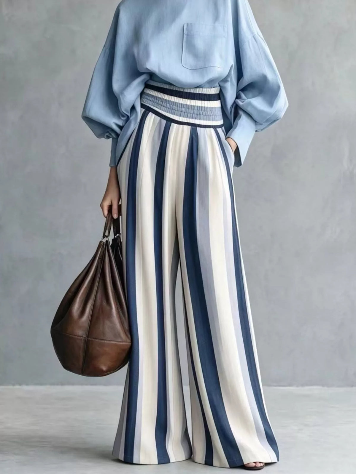 Light blue striped wide-leg pants with smocked waistband and mock-neck top two-piece set
