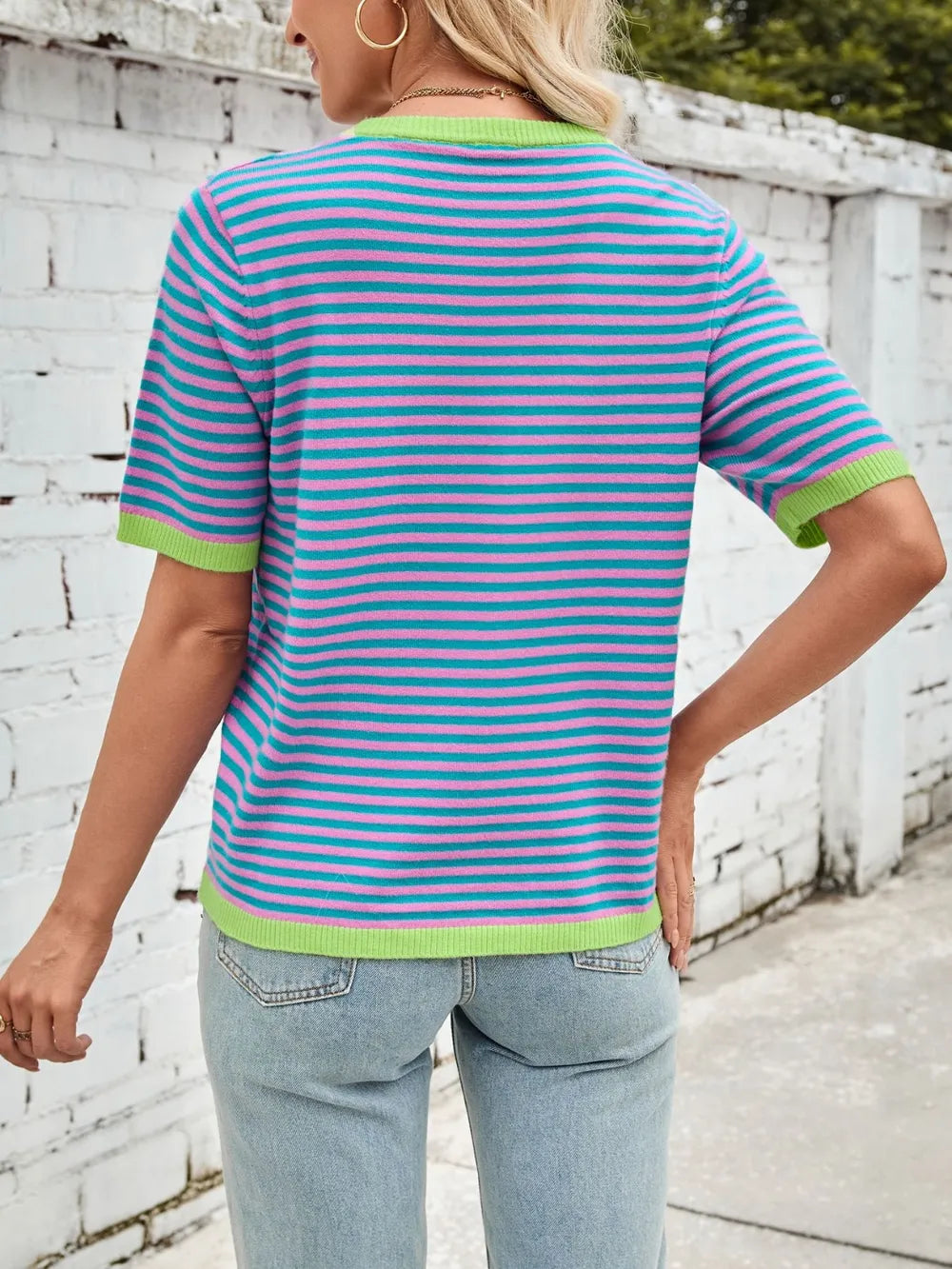 Back view of turquoise and pink striped knit top with lime green half sleeves trim