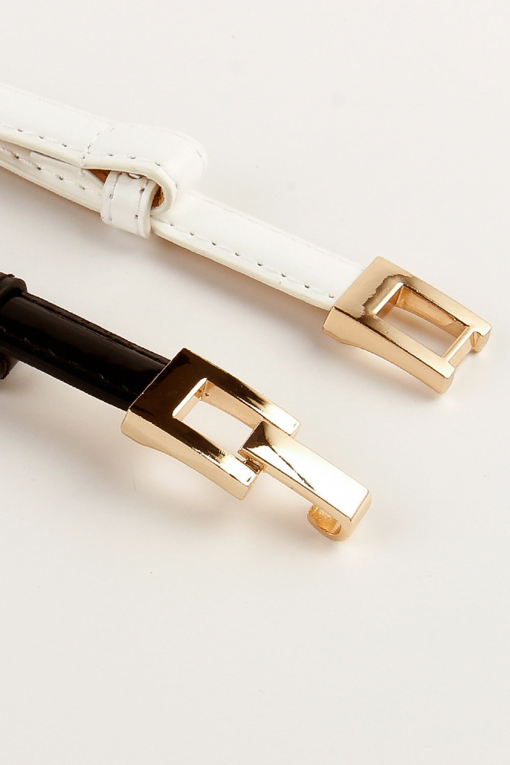Set of skinny belts: white and dark-brown, each with gold-tone square buckle