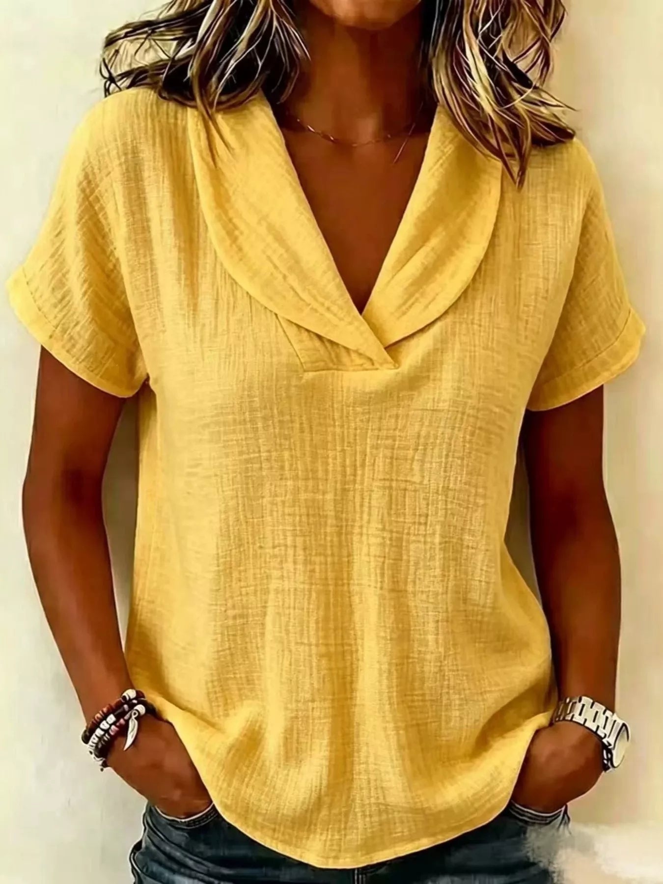 Yellow textured short-sleeve blouse with V-neck and draped front