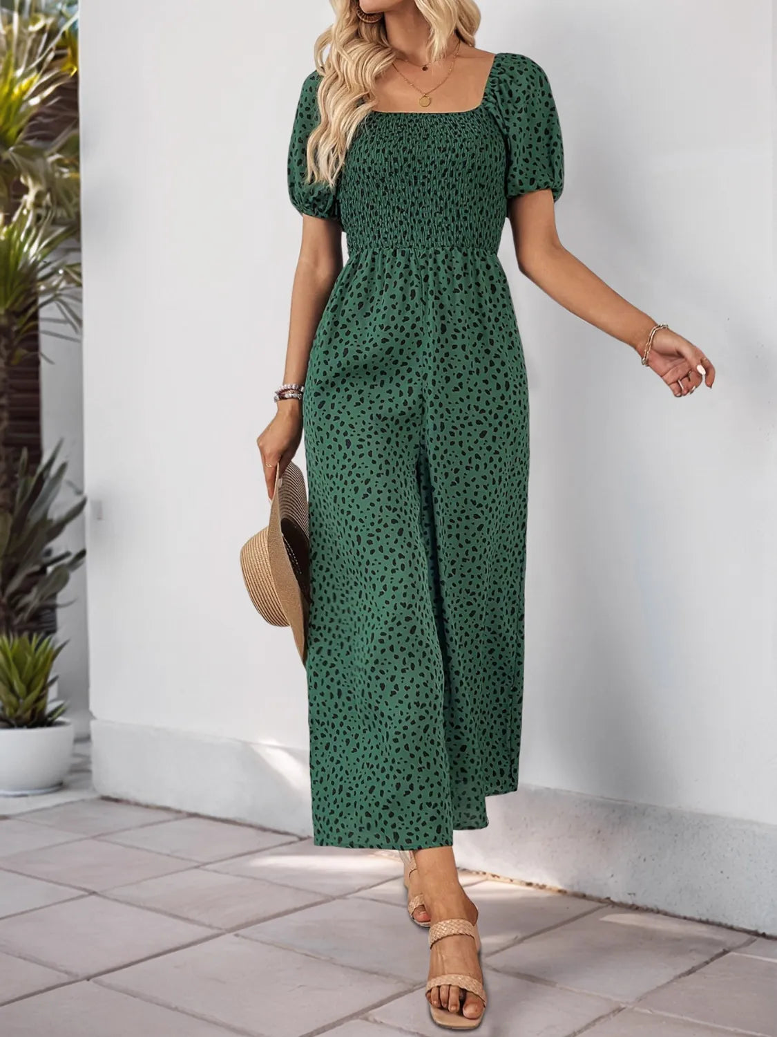 Dark green printed square-neck puff-sleeve jumpsuit, tiered waist, wide-leg culotte length
