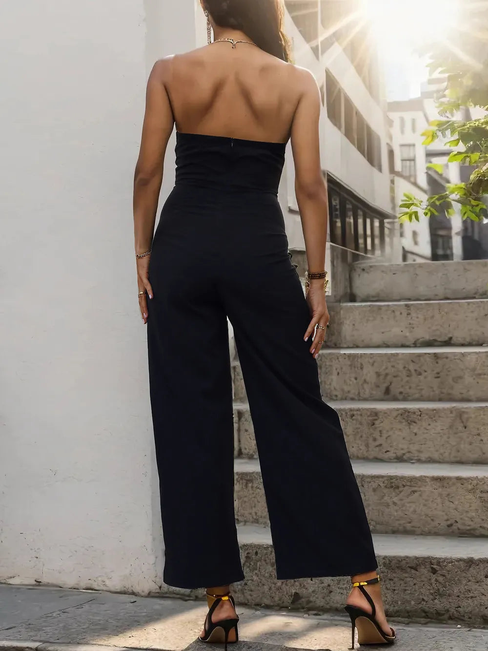 Black tube sleeveless wide-leg jumpsuit, strapless back view with contrast band