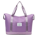 Lavender large duffle bag with two top handles, side straps, and front logo patch