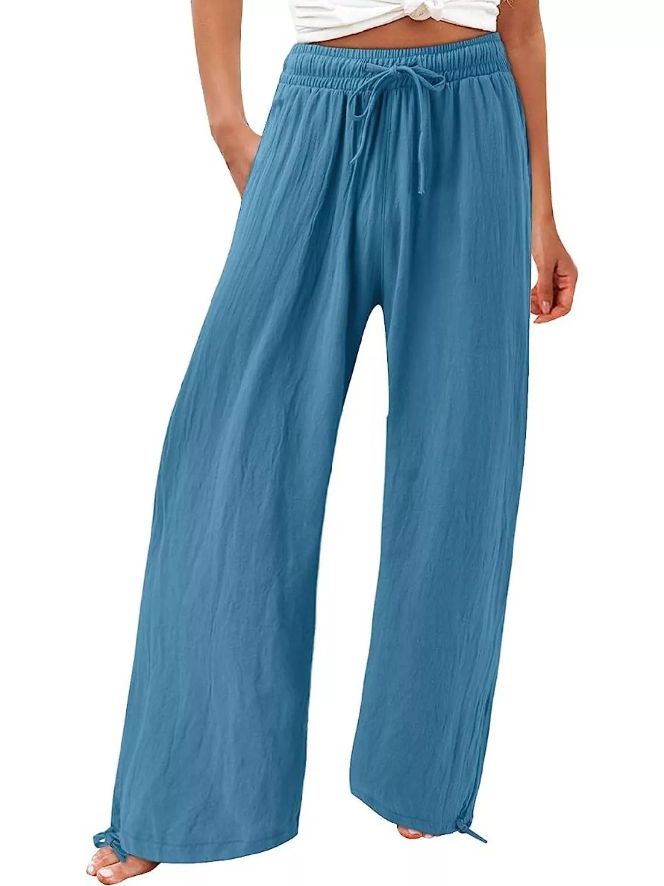 Blue wide-leg pants with drawstring waist and relaxed, airy drape