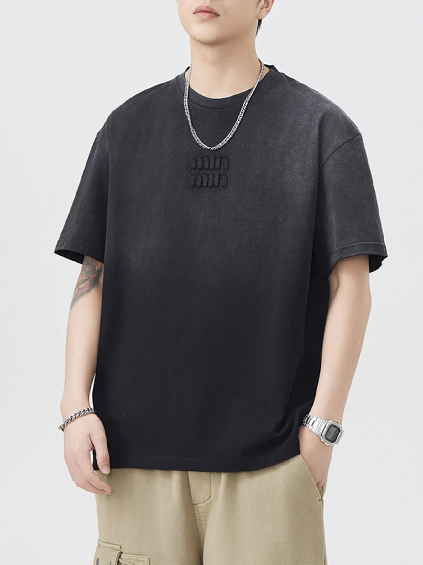 Black crewneck short-sleeve T-shirt with small chest logo
