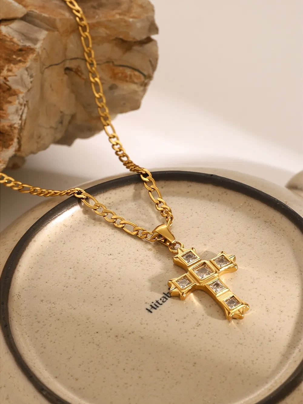 Gold-tone cross pendant necklace with square zircon accents