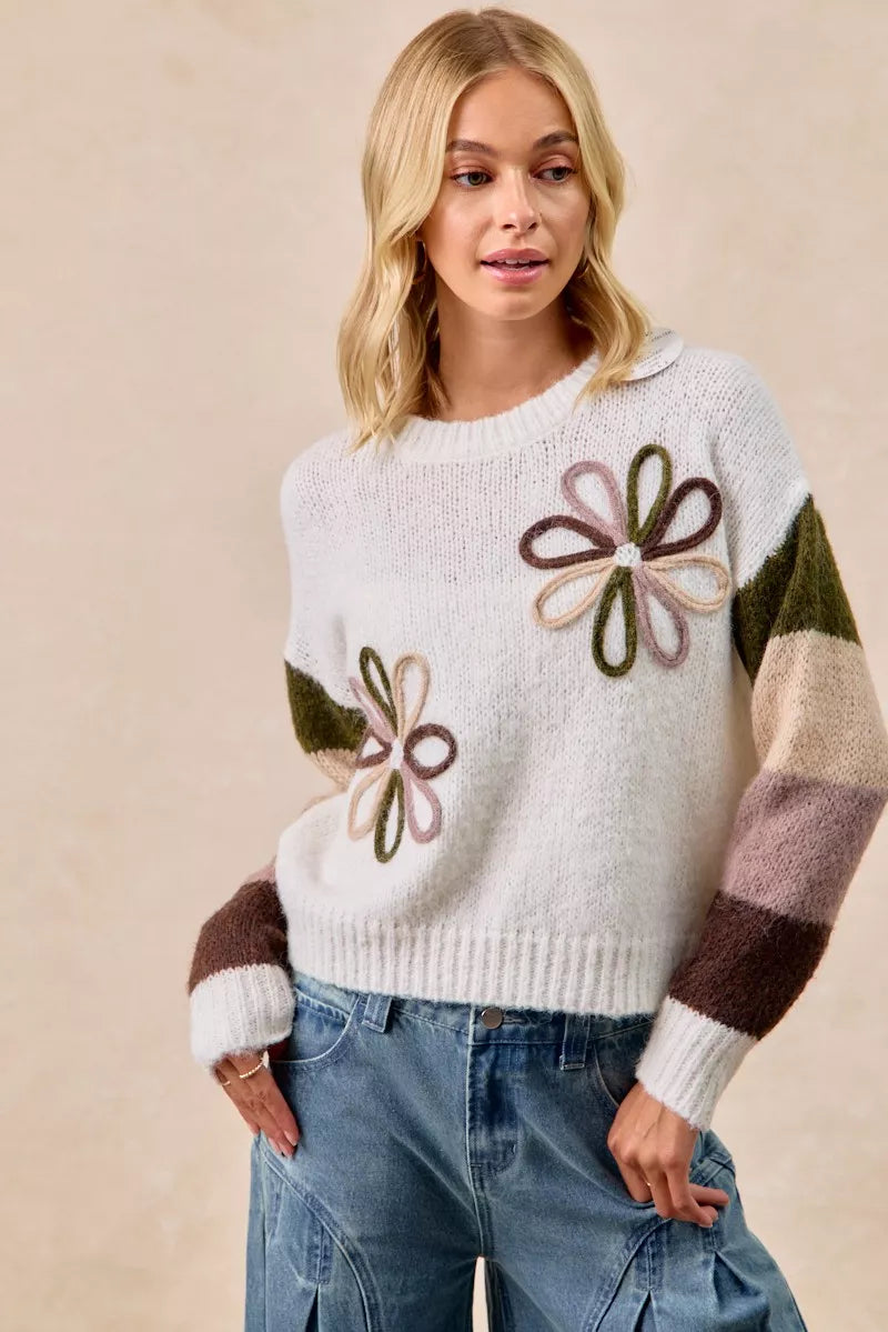 Ivory flower color block sweater with floral embroidery and contrasting sleeve stripe blocks