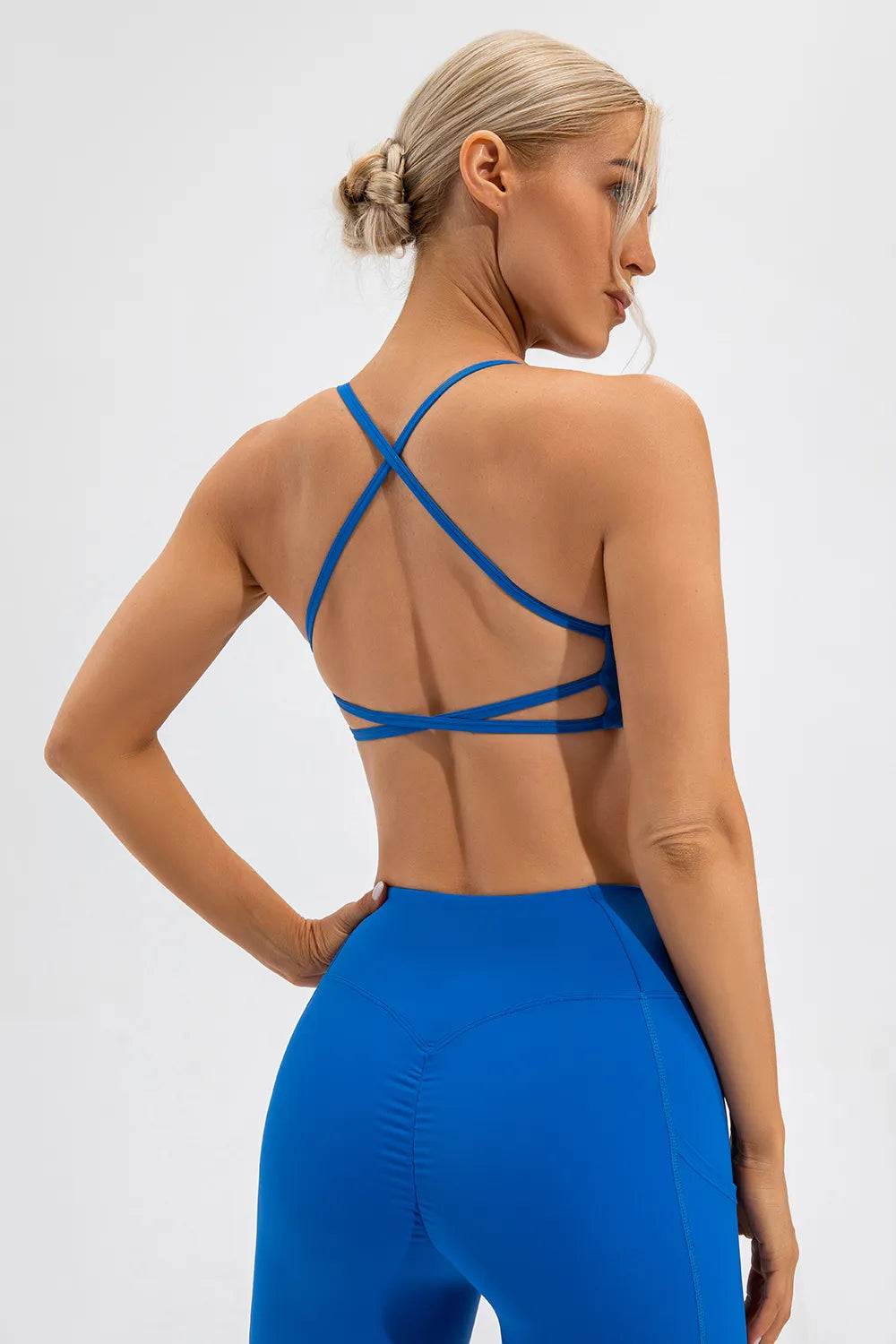 Blue active cami with crisscross back straps and thin spaghetti straps