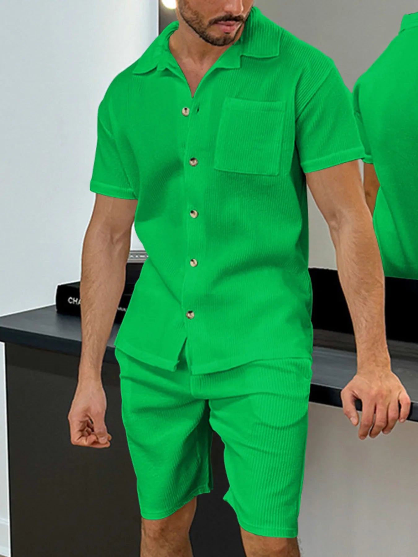 Men's green button-up short-sleeve shirt with chest pocket and matching shorts