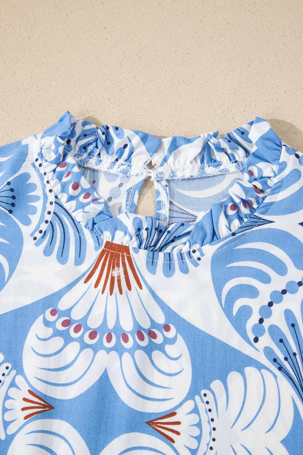 Cedar & Moore Tropical Botanic Print Flutter Sleeve Vacation Dress with blue and white ruffled neckline