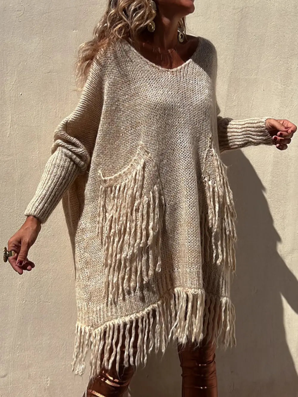 Camel knit sweater with fringe pocket panel and long sleeves in a relaxed fit.