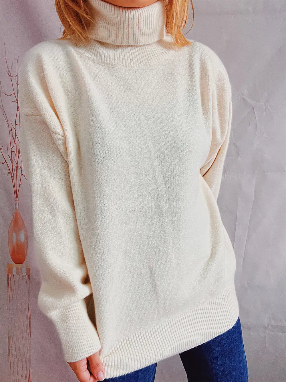Turtleneck long-sleeve sweater in cream, front view, ribbed turtleneck and cuffs.