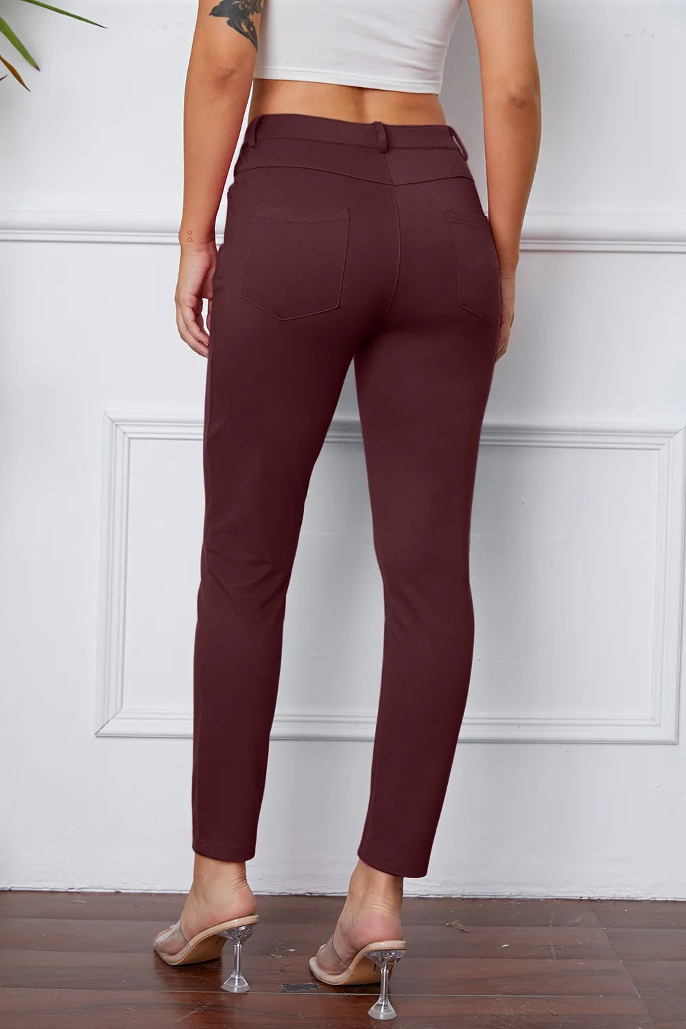 StretchyStitch pants, burgundy, back view with button closure and slim ankle legs