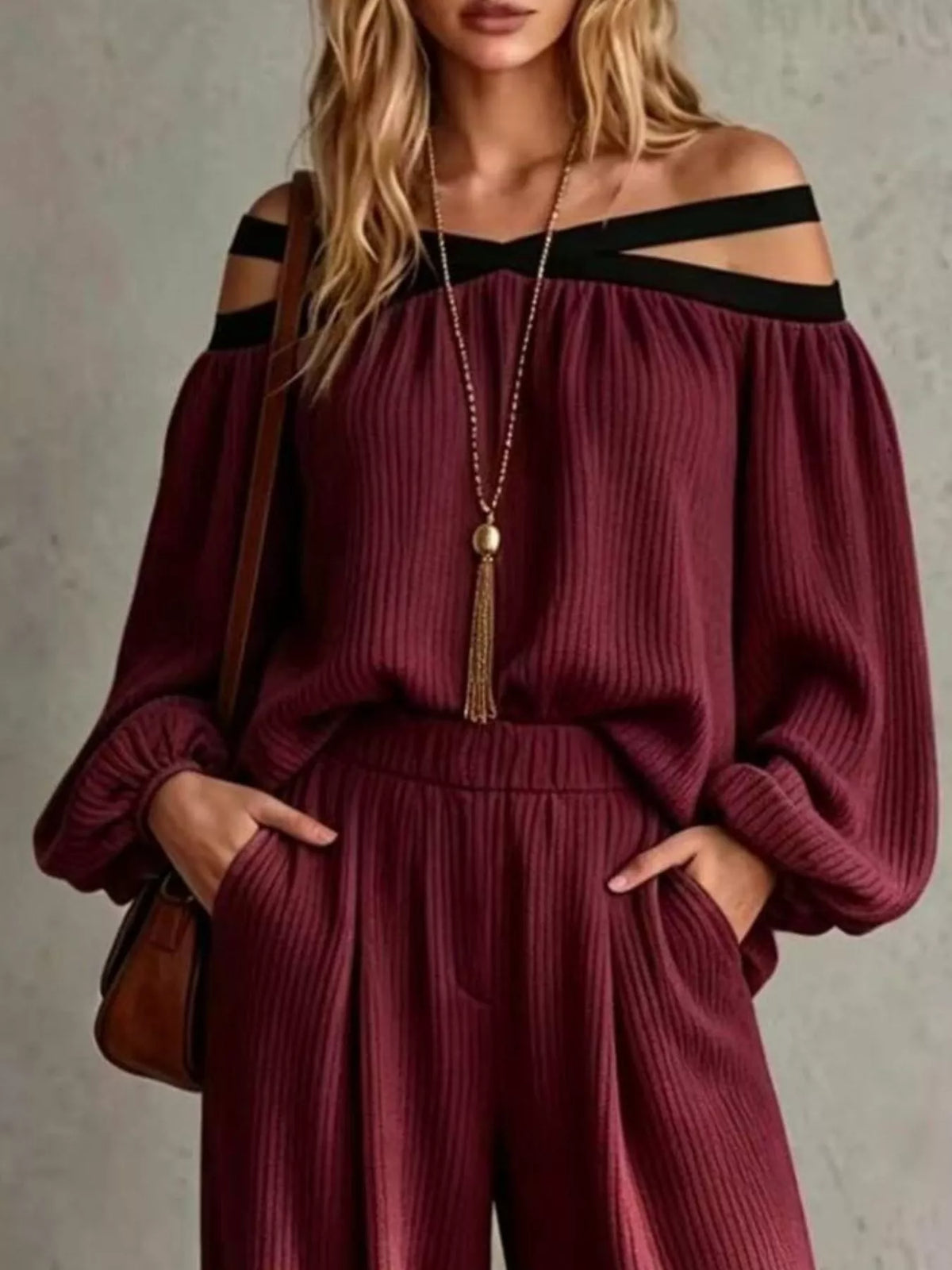 Burgundy off-shoulder ribbed knit set with crisscross neckline and wide-leg pants