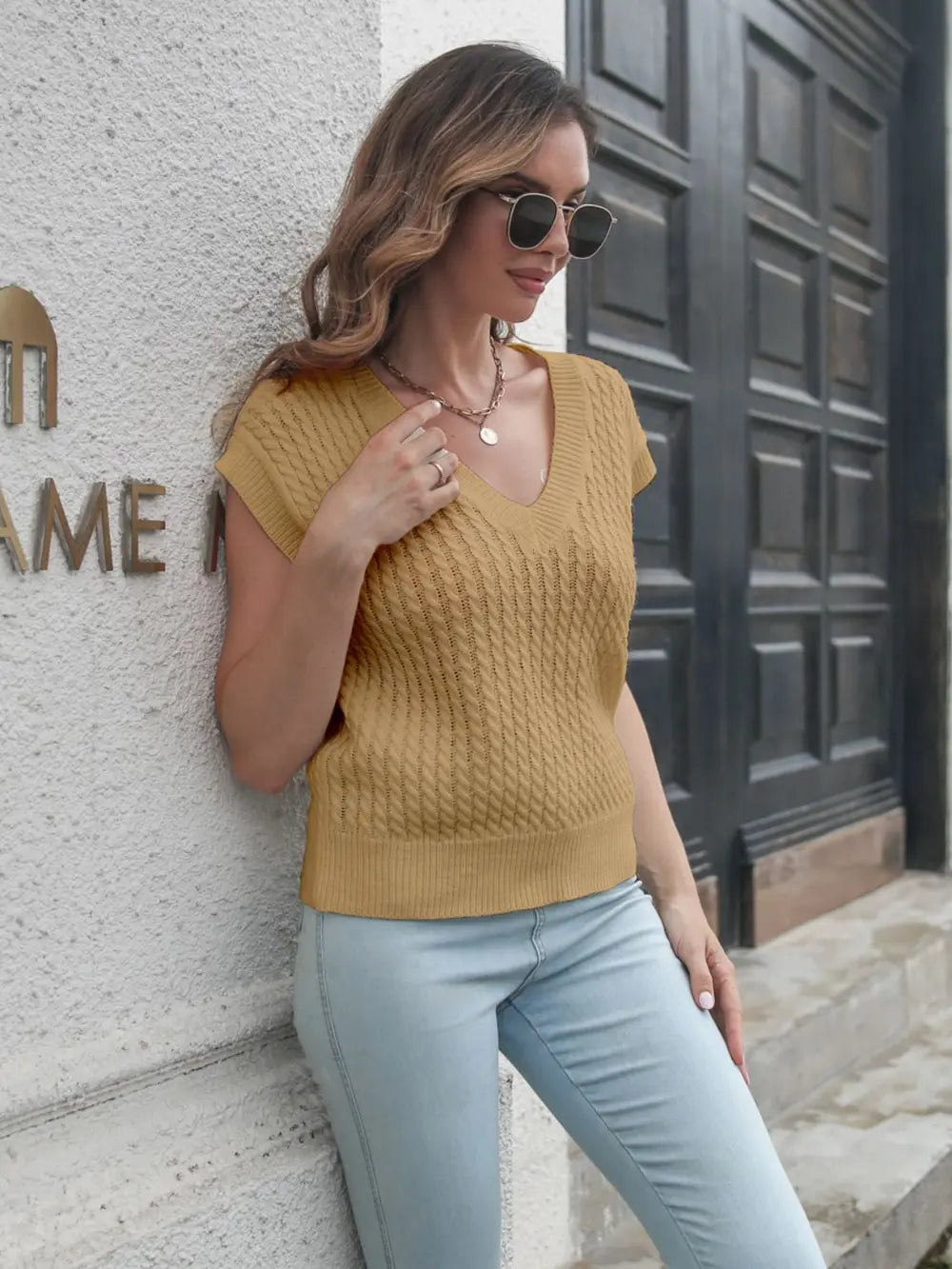 Cable-knit V-neck sweater vest, khaki yellow, front view with V-neck and rib hem.
